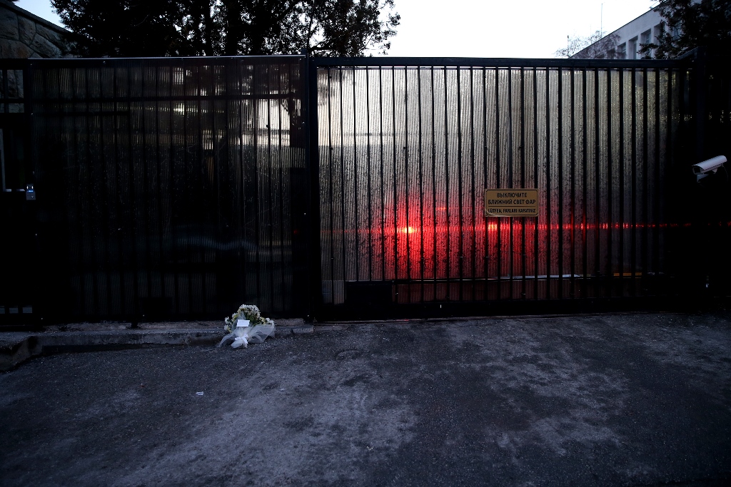 Flowers are left near the door of Russian Embassy in Turkey as security measurements are tighten in Ankara, Turkey on December 20, 2016. Metin Aktas - Anadolu Agency 