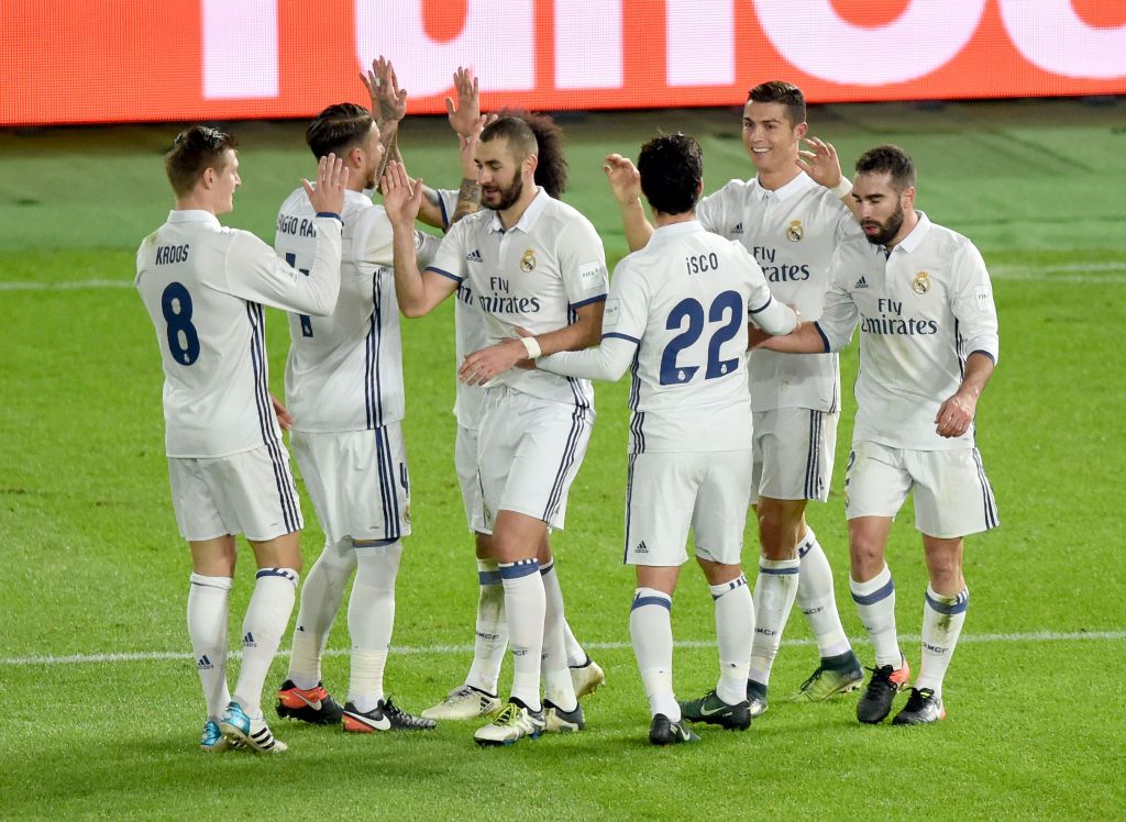 Real Madrid's forward Cristiano Ronaldo (2nd R) celebrates with his teammates after his third goal against Kashima Antlers during the Club World Cup football final match between Kashima Antlers of Japan and Real Madrid of Spain at Yokohama International s