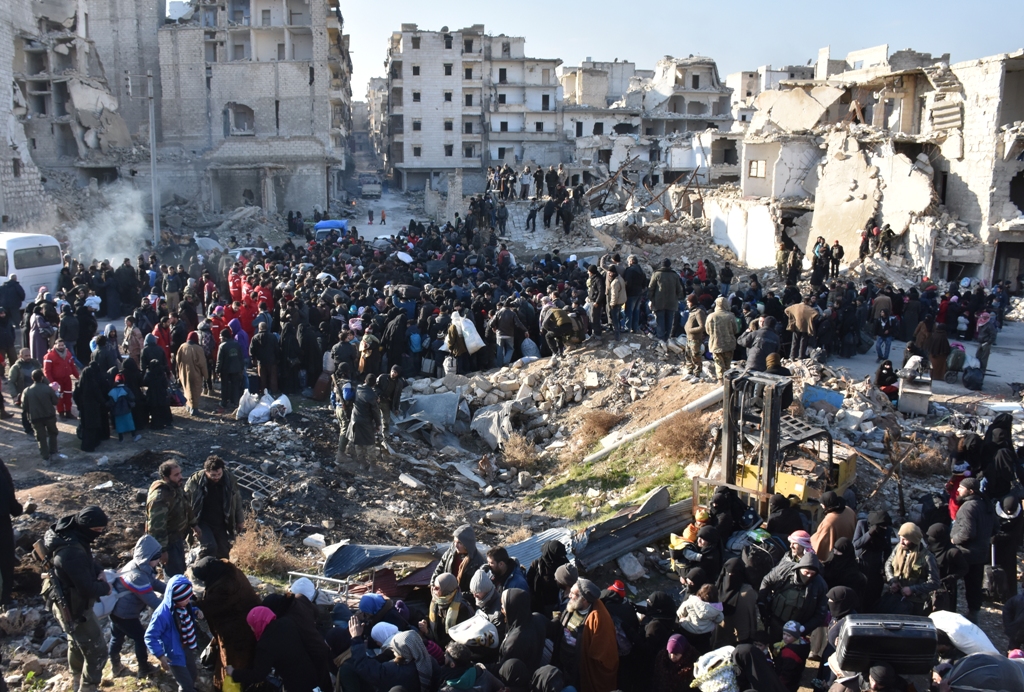 ALEPPO, SYRIA - DECEMBER 20: Civilians from East Aleppo, which was under siege by Assad regime forces and its supporter foreign terrorist groups, wait for their evacuation at Amerriye region of Aleppo, Syria on December 20, 2016. ( Mustafa Sultan - Anadol