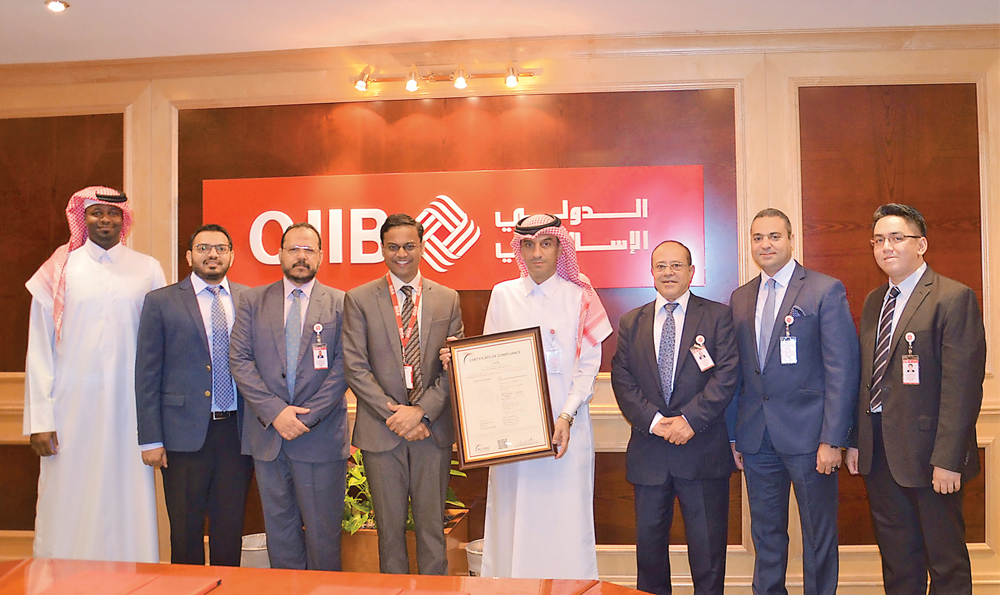 QIIB officials at the event at the bank headquarters at the Grand Hamad Street.