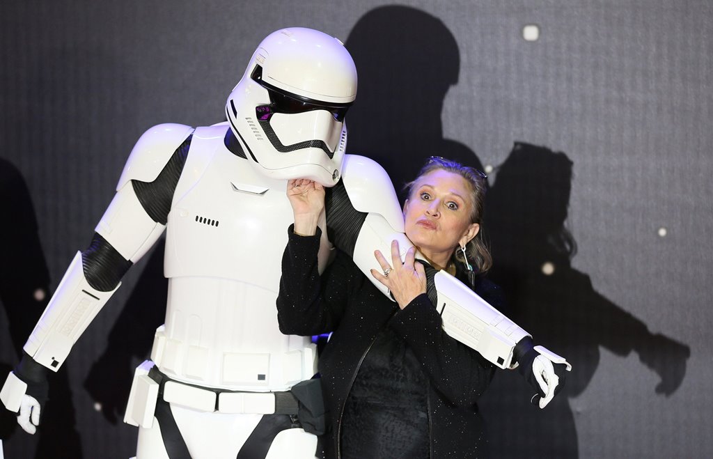 Carrie Fisher poses for cameras as she arrives at the European Premiere of Star Wars, The Force Awakens in Leicester Square, London, December 16, 2015. REUTERS/Paul Hackett/File Photo