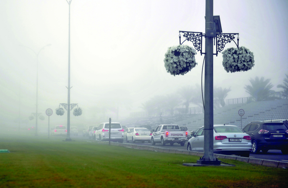 Heavy fog on the Corniche Road early yesterday morning. Pic: Abdul Basit/ The Peninsula