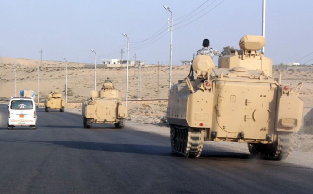 A convoy of Egyptian armoured vehicles travel along a road in El-Arish in the Sinai Peninsula. Photo: AFP