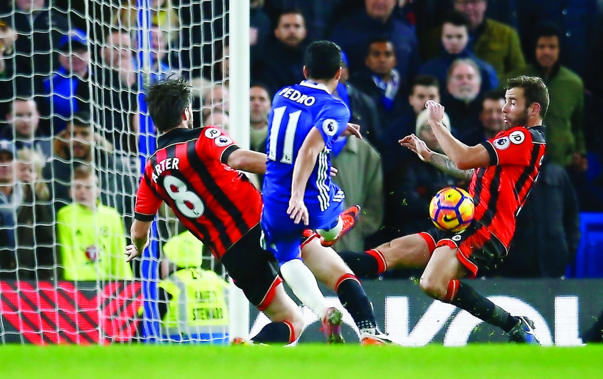 Pedro scores Chelsea's third goal during their English Premier League match against AFC Bournemouth at Stamford Bridge in Fulham, London yesterday.