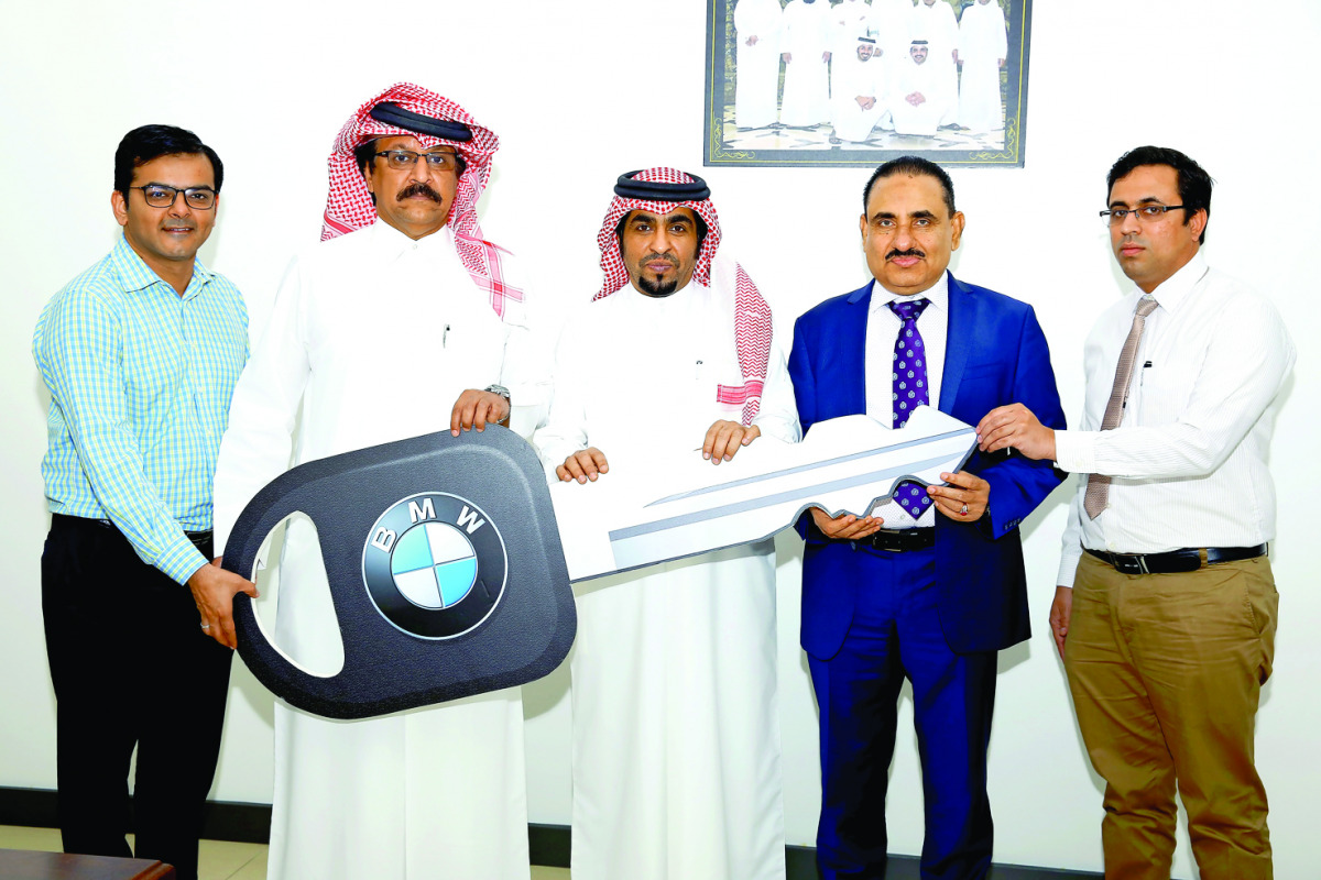 One of the winners of Safari Win 10 BMW 5 series car promotion second lucky draw, Ahmad Saad Ahmad Al Jaham Al Kuwari 
(Coupon No. 1030100), receiving the key from Hamad Dafer Abdulhadi Al Sofan Al Ahbabi, Chairman of Safari Group, and Zainul Abideen, Di