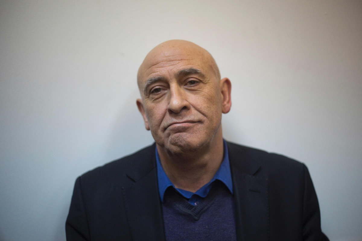 Arab Israeli lawmaker Basel Ghattas appears at the Magistrate Court in Rishon Letzion, central Israel on December 26, 2016. Israeli police said they arrested an Arab lawmaker whose immunity has been lifted after he was suspected of secretly giving cellpho