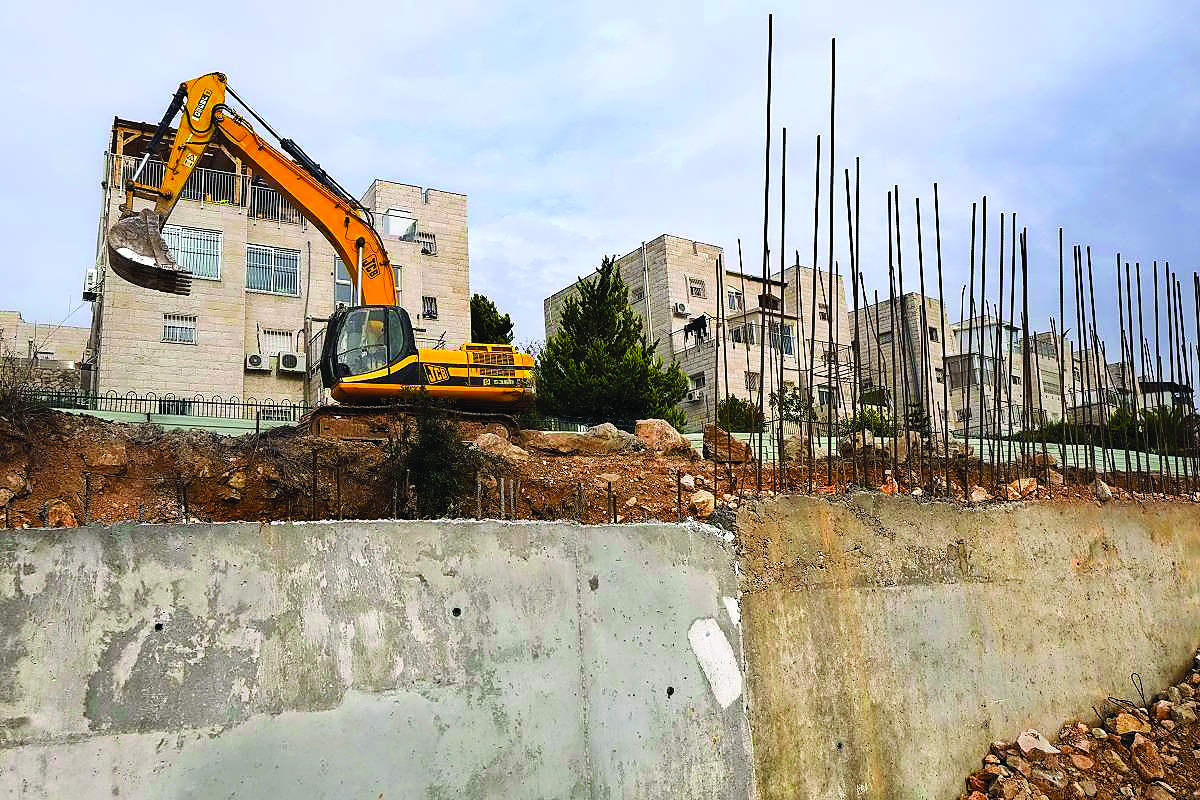 Earth-moving equipment stands in the disputed Israeli settlement of Ramat Shlomo after reports emerged that an additional 300 housing units are planned for this neighbourhood.