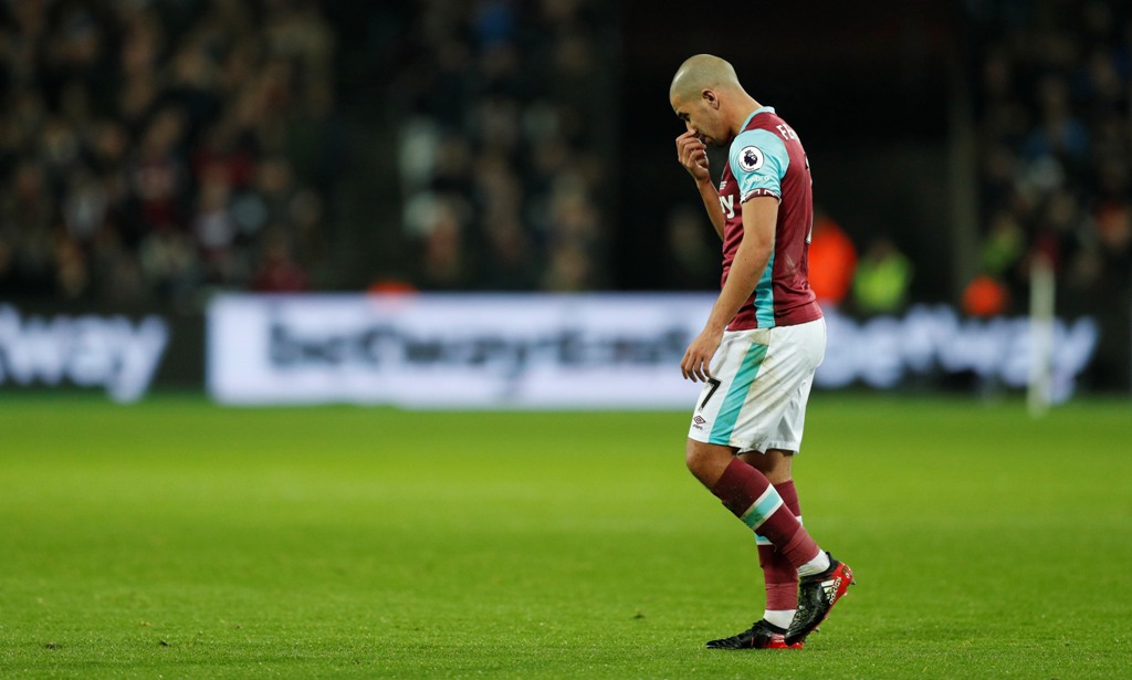 West Ham United's Sofiane Feghouli looks dejected after being sent off. Reuters / John Sibley 
