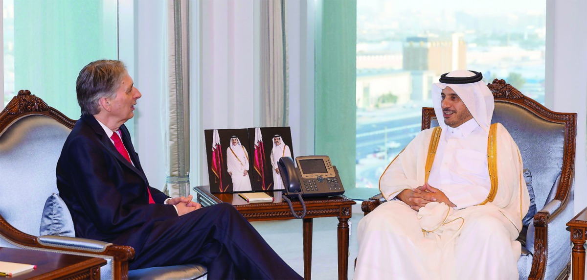 Prime Minister and Interior Minister H E Sheikh Abdullah bin Nasser bin Khalifa Al Thani with UK Chancellor of the Exchequer, Philip Hammond, yesterday. They discussed bilateral relations and means to promote them.
