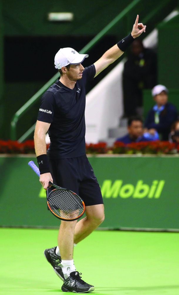 Britain's Andy Murray reacts as he plays against Austria's Gerald Melzer during the second round of the ATP Qatar Open tennis competition in Doha on Wednesday. The world number one star Murray claimed his 26th consecutive victory on Wednesday night with a
