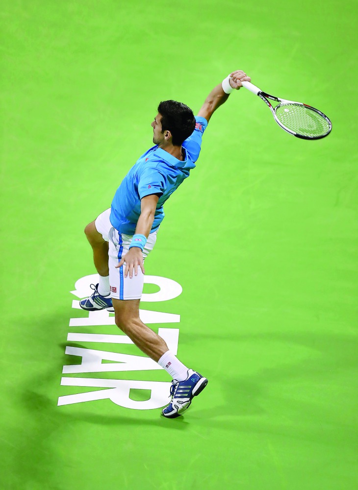 Novak Djokovic of Serbia hits a return to Radek Stepanek of Czech Republic during their Qatar ExxonMobil Open men's singles quarter-final played yesterday. Djokovic eased through to his first semi-final of the season and beat veteran Stepanek 6-3, 6-3.