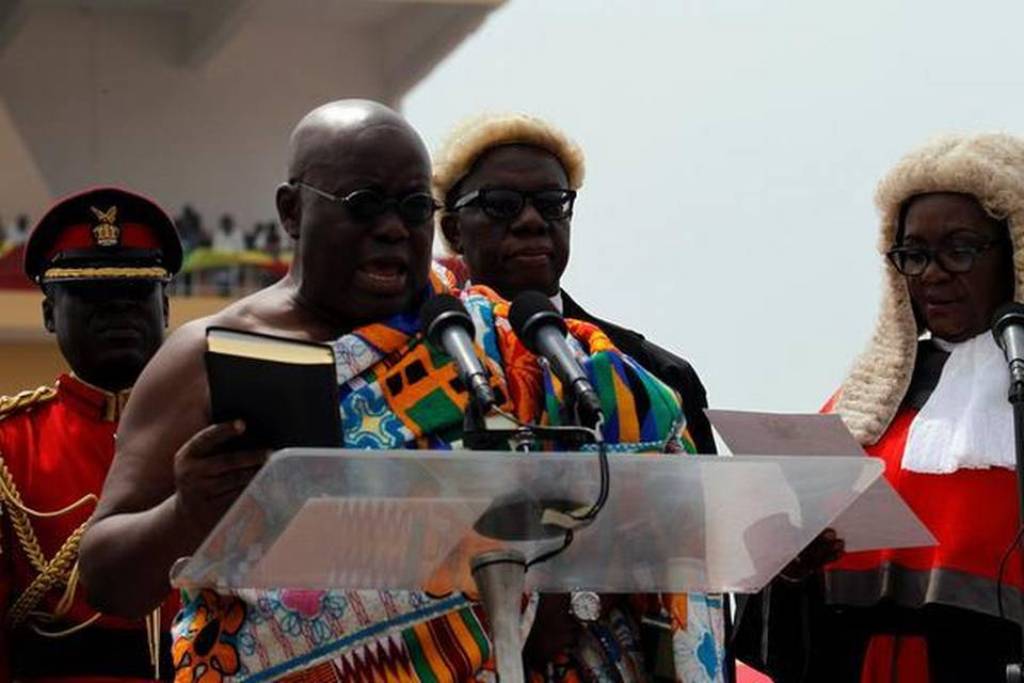 Nana Akufo-Addo takes the oath of office as Ghana’s new President during the swearing-in ceremony officiated by country’s Chief Justice Georgina Theodora Wood at Independence Square in the capital Accra on January 7, 2017. Mahamudu Bawumia was sworn in Gh