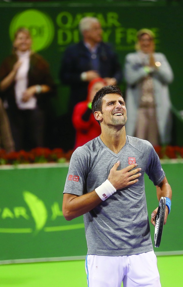 Novak Djokovic of Serbia celebrates after winning the Qatar ExxonMobil Open 2017.