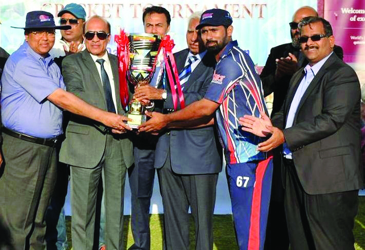 Galfar Al Misnad captain receiving the trophy after the final of QCA Tournament Division A title  at Asian Town Cricket Stadium in Doha recently.  