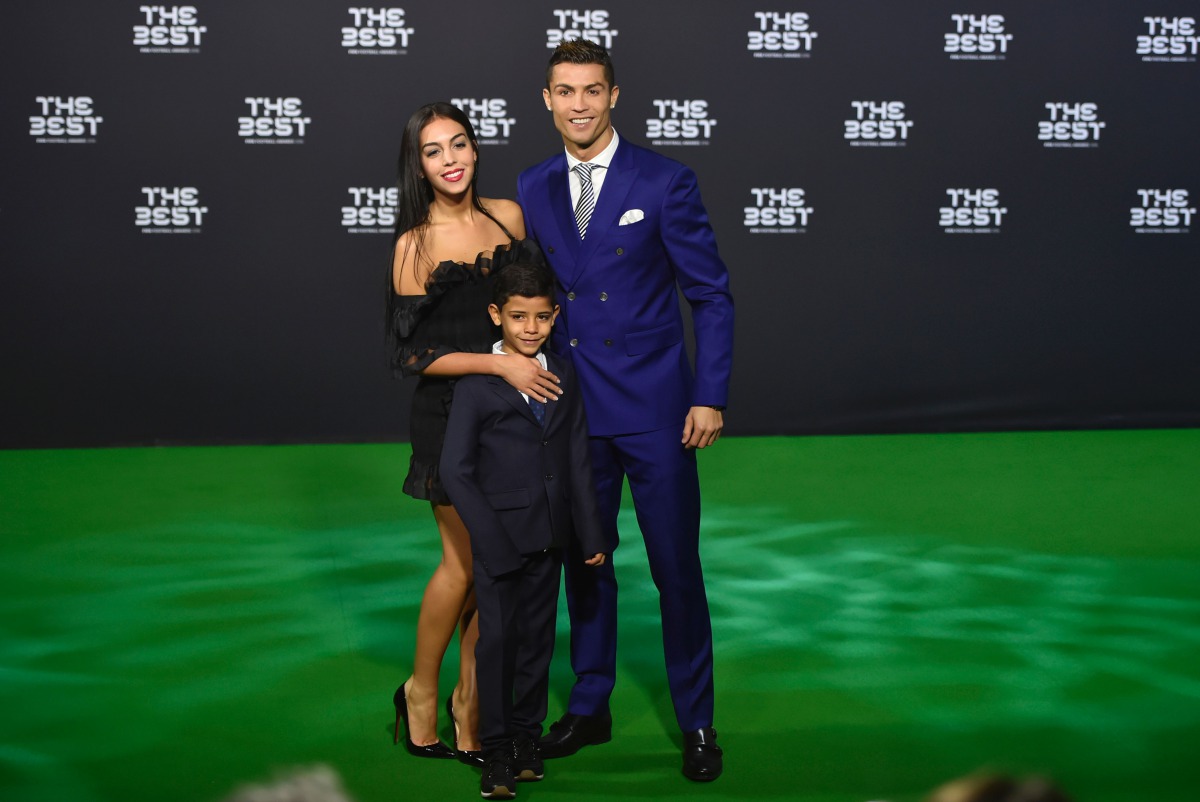 Real Madrid and Portugal's forward Cristiano Ronaldo poses with partner Georgina Rodriguez and his son Cristiano Ronaldo Jr as they arrive for The Best FIFA Football Awards 2016 ceremony, on January 9, 2017 in Zurich. (AFP / MICHAEL BUHOLZER)