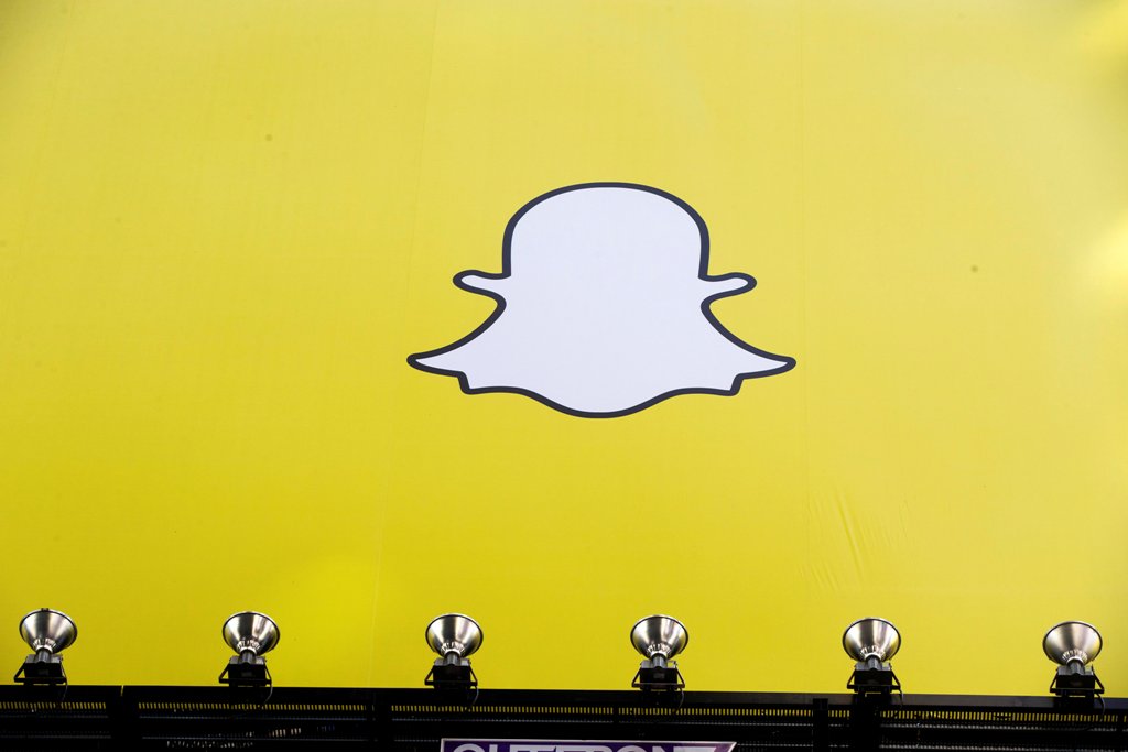 FILE PHOTO: A billboard displays the logo of Snapchat above Times Square in New York March 12, 2015. REUTERS/Lucas Jackson/File Photo
