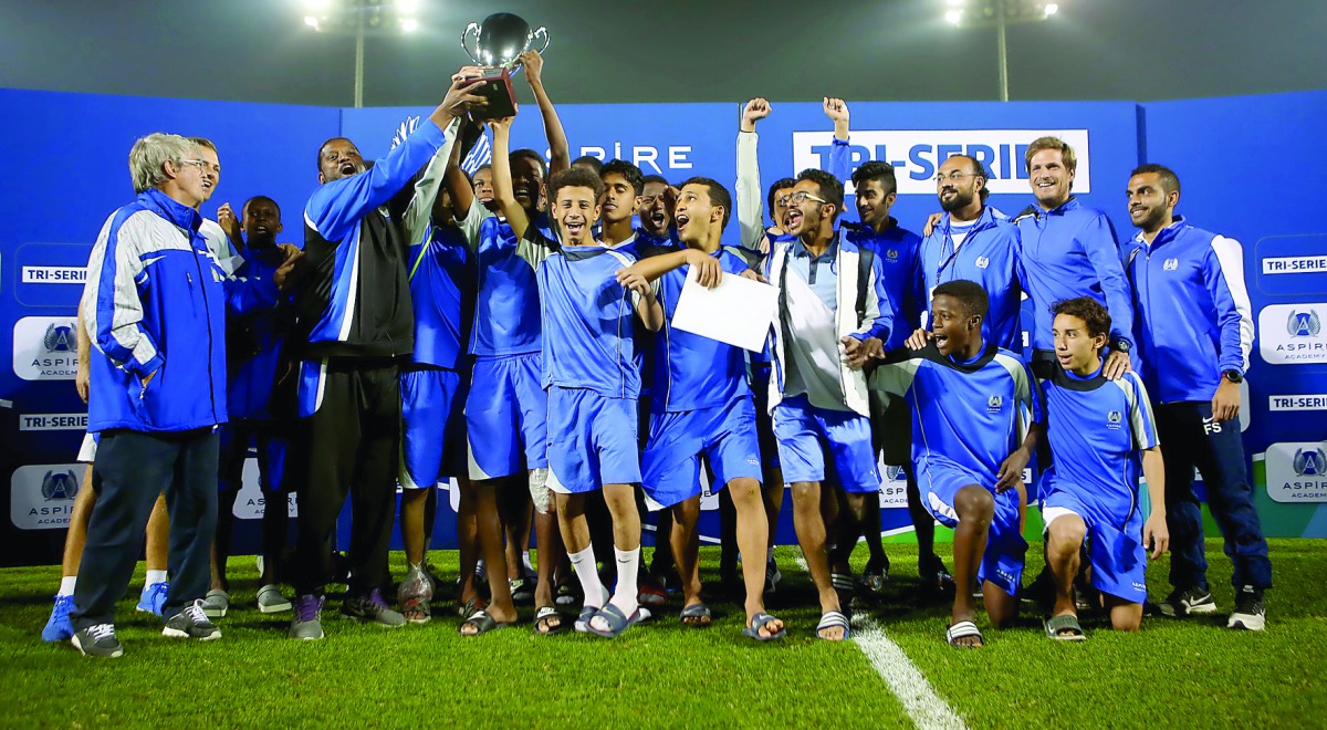 Aspire Academy’s U-16 team and officials celebrate after winning the Tri-Series in Doha.