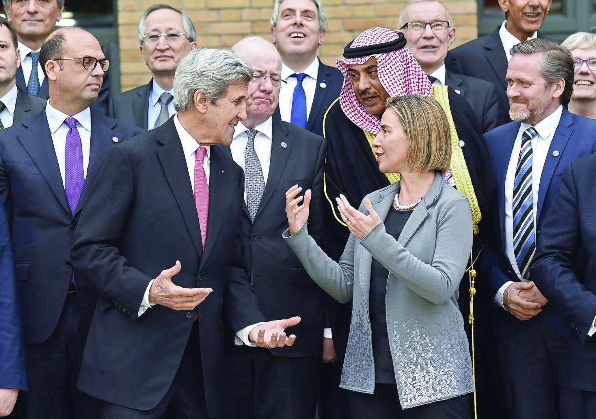 US Secretary of State John Kerry with European Union Foreign Policy Chief Federica Mogherini and other foreign ministers and representatives during the Mideast peace conference in Paris, France, yesterday.