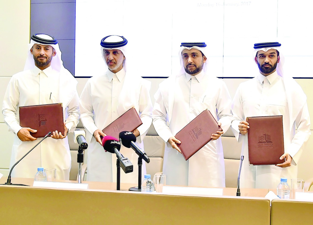 Officials of Qatar University, Qatar Football Association, Aspire Zone, and Supreme Committee for Delivery and Legacy during the MoU signing ceremony.