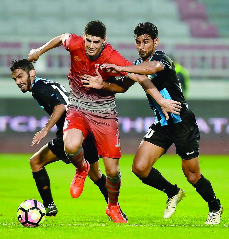 Karim Boudaif (centre) of Lekhwiya controls the ball against two Al Wakrah players during their Qatar Stars League match played at Abdullah Bin Khalifah Stadium yesterday. Lekhwiya rallied from a three-goal deficit to draw with league strugglers Al Wakrah