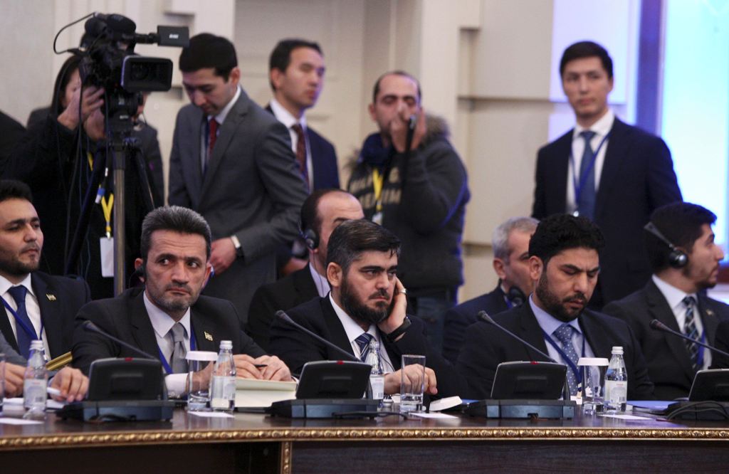 Mohammad Alloush (C), the head of the Syrian opposition delegation, attends Syria peace talks in Astana, Kazakhstan January 23, 2017. REUTERS/Mukhtar Kholdorbekov