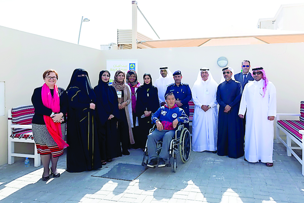 Representatives of HMC, the Community Police, Human Rights Departments and Qatar Building Company with a Bayt Aman guest.