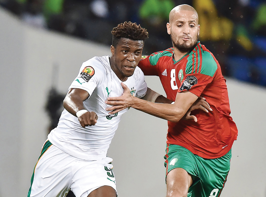 Morocco's midfielder Karim El Ahmadi (right) challenges Ivory Coast's forward Wilfred Zaha during the 2017 Africa Cup of Nations group C match b in Oyem on Tuesday. Morocco won 1-0 to advance to the next stage.