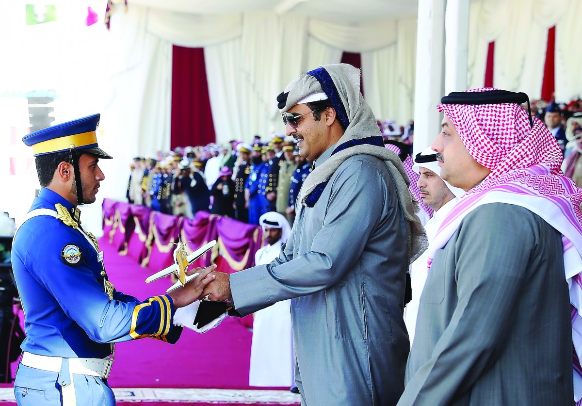 Emir H H Sheikh Tamim bin Hamad Al Thani at the Al Zaeem Mohamed Bin Abdullah Al Atiyyah Air College at Al Udeid Air Base yesterday. The Emir attended the graduation ceremony of the fourth batch of students with the Prime Minister and Interior Minister H 