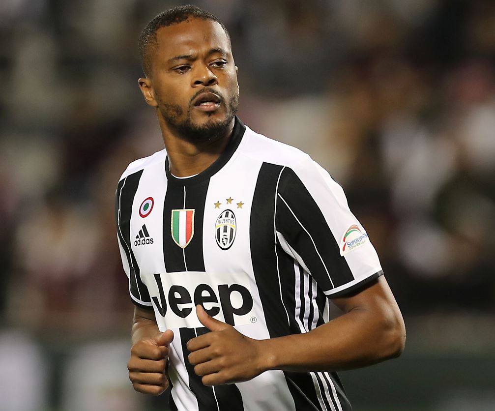 (FILES) This file photo taken on December 23, 2016 shows Juventus' Patrice Evra running during the Italian Super Cup final match between AC Milan and Juventus in Doha. AFP / KARIM JAAFAR
