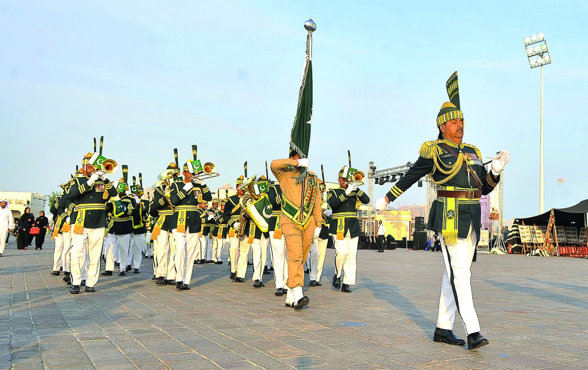 Pakistani Military Band performing at Katara yesterday. RIGHT: Shahzad Ahmad, Pakistan Ambassador to Qatar, Ibrahim Fakroo, Director of Protocol at the Ministry of Foreign Affairs and Ahmad Al Sayed, Deputy General Manager at Katara with other diplomats a
