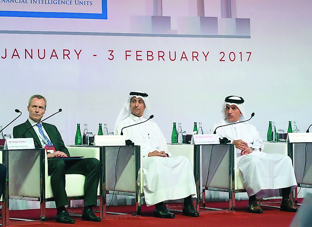 Minister of Finance H E Ali Shareef Al Emadi (right) with other speakers at the opening session of  the working group meeting of  the Egmont Group in Doha , yesterday