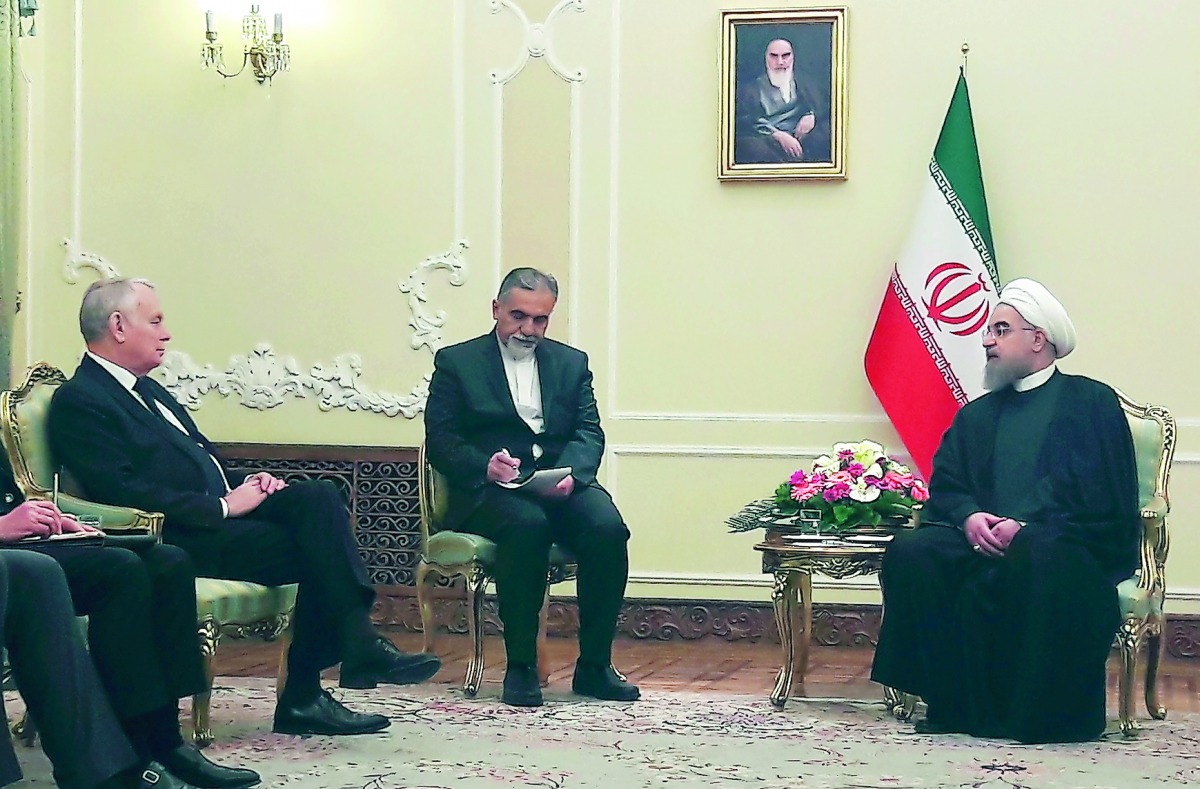 Iranian President Hassan Rowhani with French Foreign Minister Jean-Marc Ayrault in Tehran, yesterday.