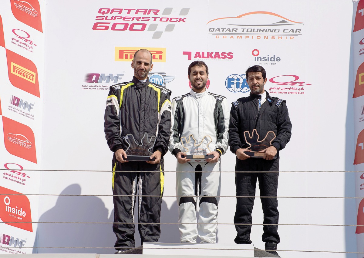 Abdulla Al Khelaifi, Mansour Al Hajri and Mahmoud Al Khalaf, the podium winners at round two of the Qatar Touring Car Championship pose for a group picture at the Losail International Circuit. Al Khelaifi produced a dazzling performance, winning both race