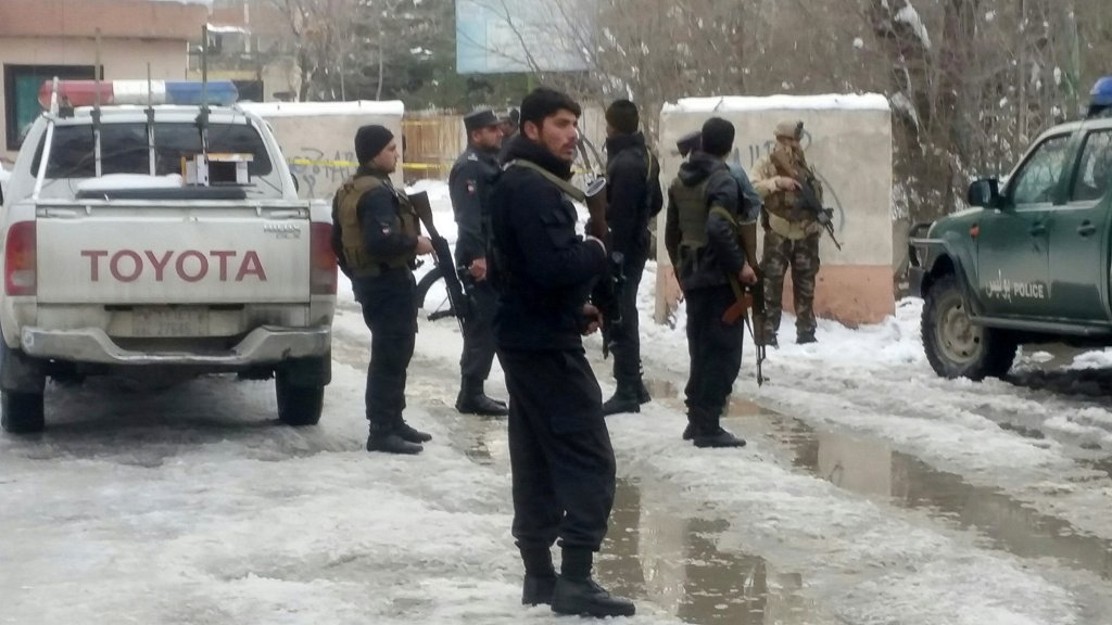Afghan policemen keep watch at the site of a bomb blast in Kabul, Afghanistan February 7, 2017. REUTERS/Omar sobhani
