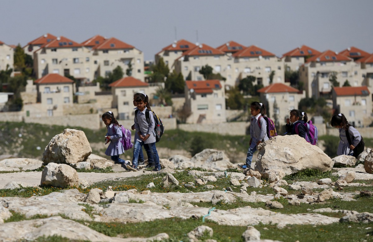 Palestinian students return from school to their homes near the Jewish settlement of Maale Adumim in the West Bank village of Al-Eizariya, east of Jerusalem March 1, 2016 (REUTERS / Ammar Awad) 