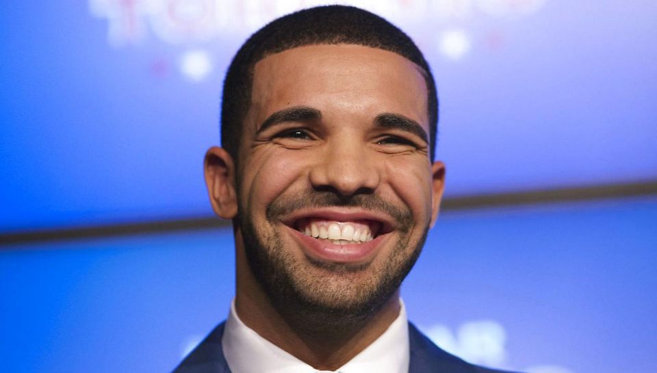 Rapper Drake smiles during an announcement that the Toronto Raptors will host the NBA All-Star game in Toronto, September 30, 2013. REUTERS/Mark Blinch