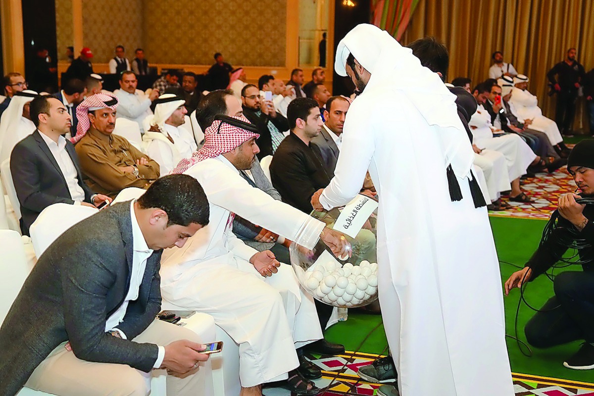 The Ministry of Economy and Commerce officials conducting the open raffle draw at The Ritz-Carlton, Doha, yesterday. 