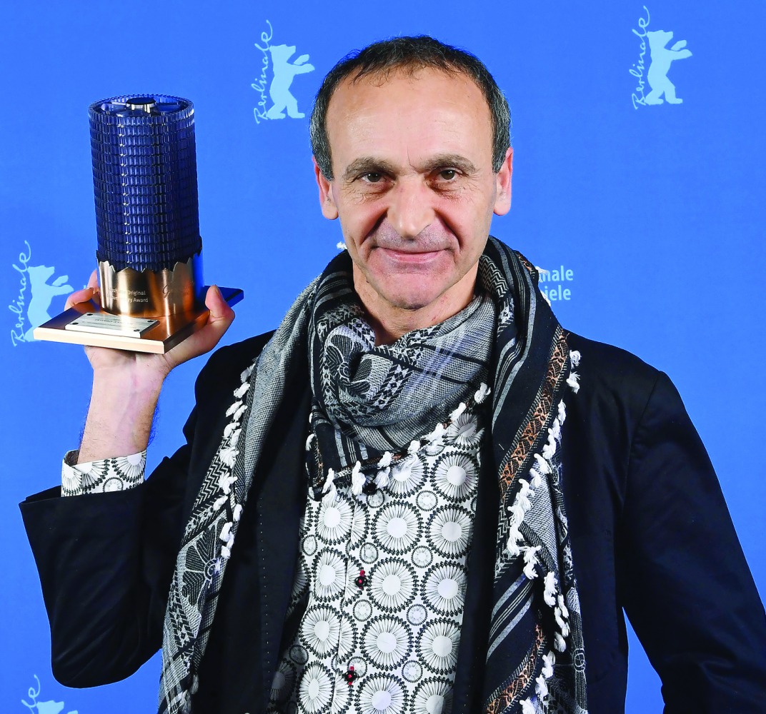 Palestinian director Raed Andoni poses after being awarded for Best documentary for his film 
