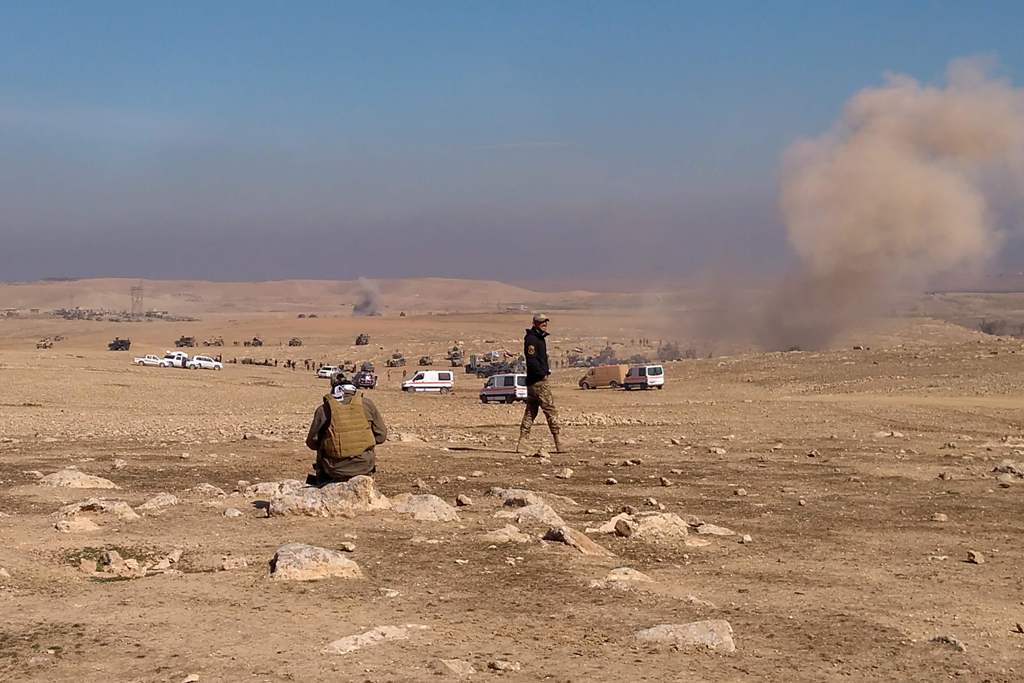 Smoke billows following a strike as Iraqi security forces hold a position near the village of al-Buseif, south of Mosul, during an offencive to retake the western side of the city from Islamic State (IS) group fighters on February 19, 2017. AFP / Marisol 