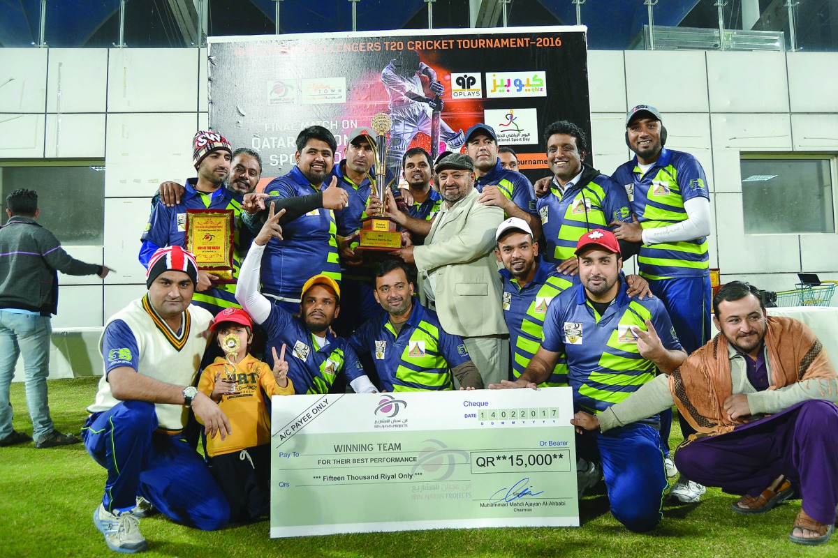 Al Hamra CC players and officials pose with the trophy after winning the final. 