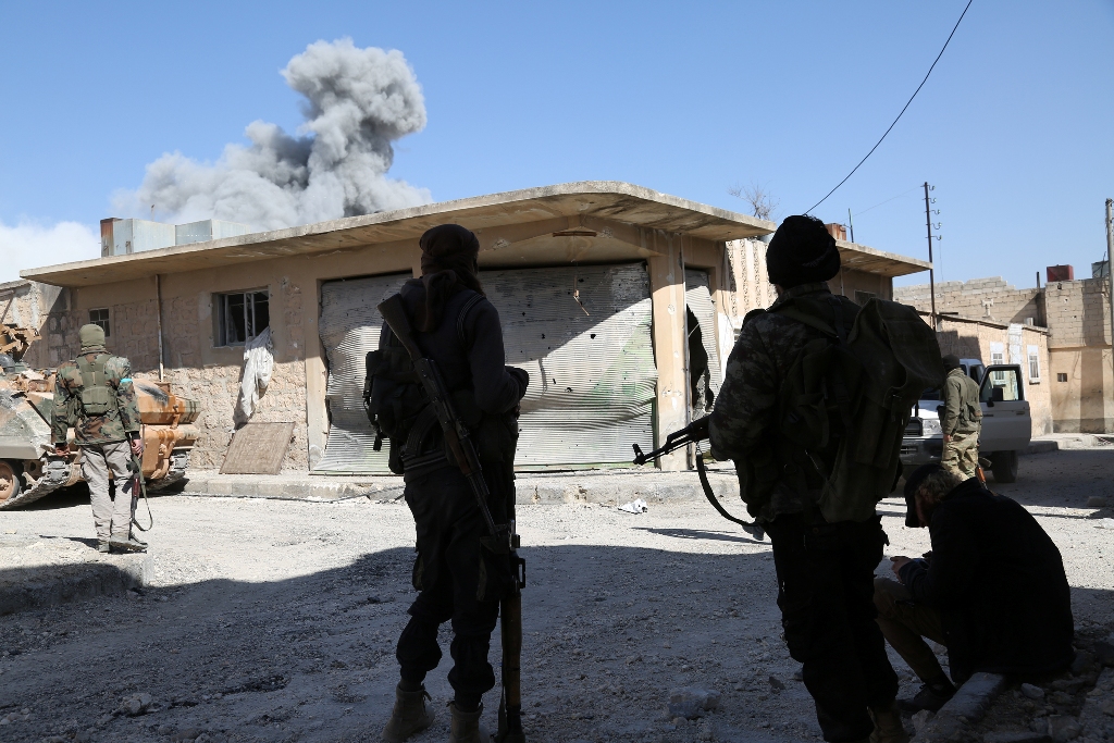 Free Syrian Army (FSA) members, supported by the Turkish Armed Forces, clash with Islamic State terrorists in Al-Bab town of Aleppo during the 183rd day of the 