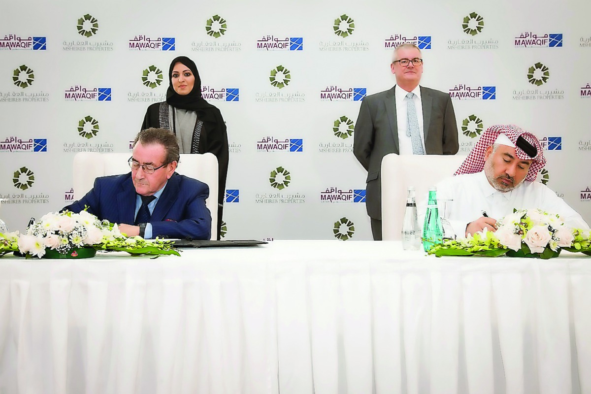 Abdulla Hassan Al-Mehshadi, Chief Executive Officer, Msheireb Properties, and Gilles Guillochon, CEO of Mawaqif, signing the agreement.