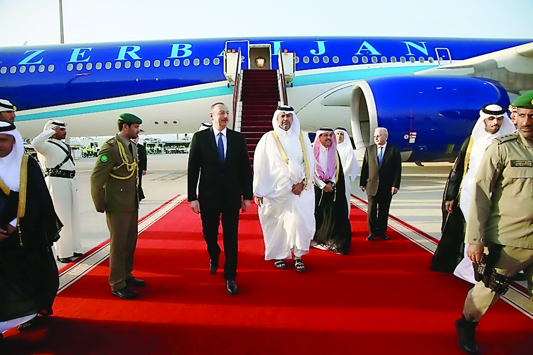 President of the Republic of Azerbaijan, Ilham Aliyev, being received at the  Hamad International Airport by the Minister of Economy and Commerce H E Sheikh Ahmed bin Jassim bin Mohammed Al Thani, yesterday.