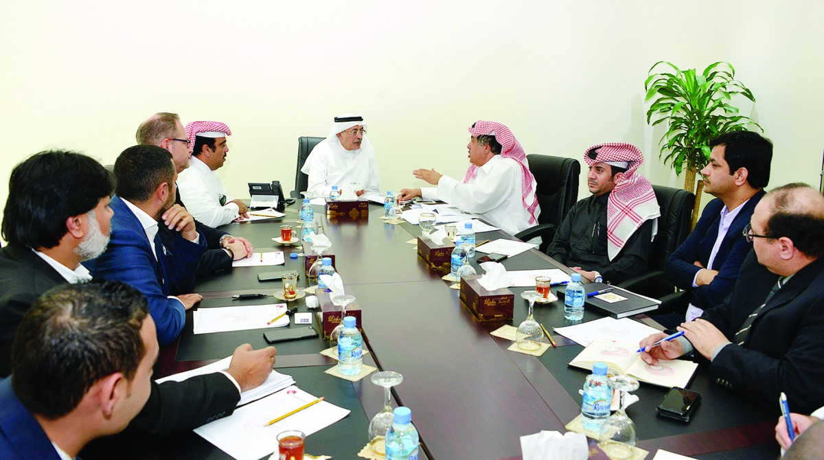 Adil Abdurrahman Al Mannai (centre), Head of the Trade and Research Committee at Qatar Chamber, with owners and representatives of major shopping malls in a meeting at the headquarters of Qatar Chamber.