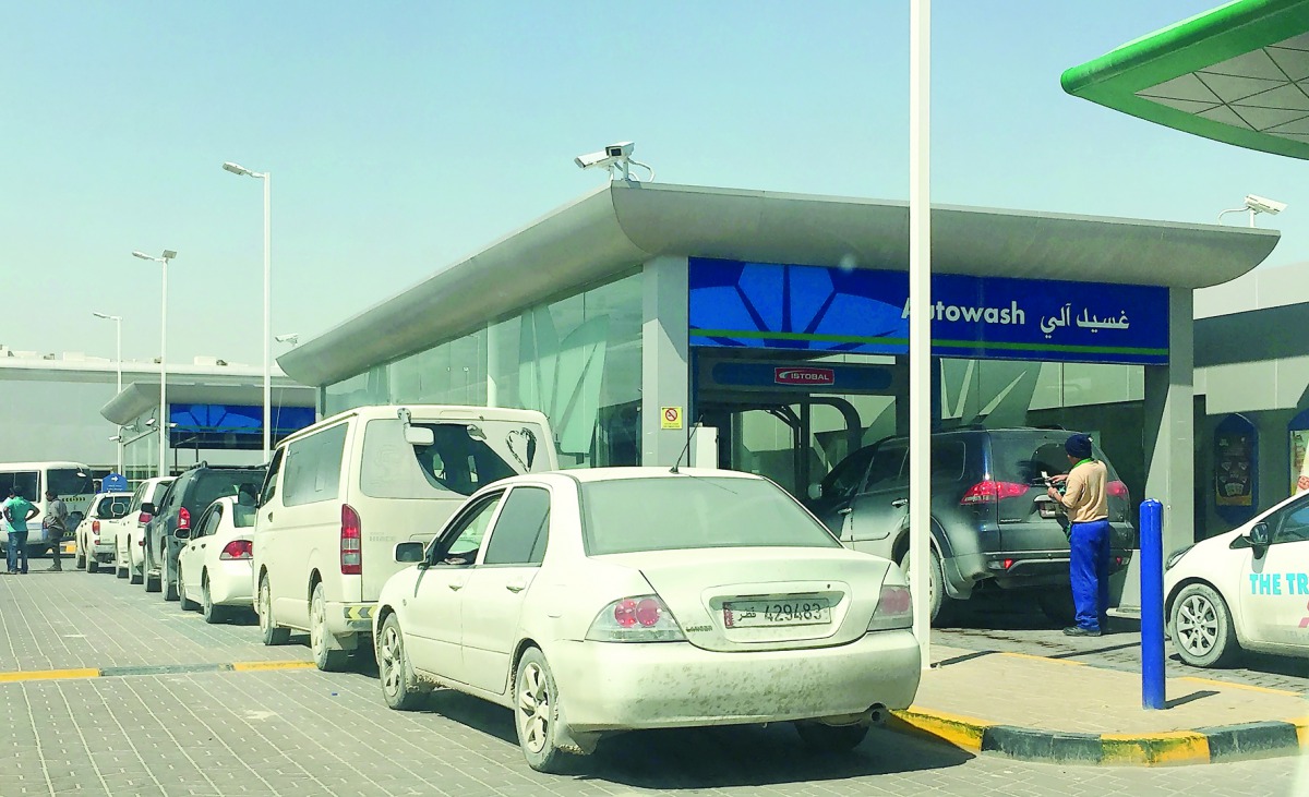 Long queue of cars at a service station in Doha. 