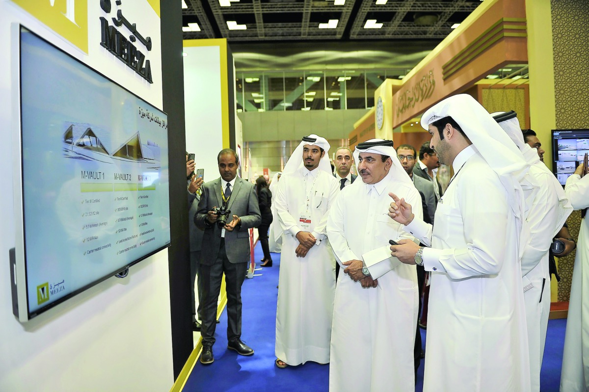 Minister of Transport and Communication, H E Jassim bin Saif Al Sulaiti (second right) visiting one of the booths during the QITCOM Conference and Exhibition which kicked off at QNCC yesterday. Pic:  Baher Amin / The Peninsula