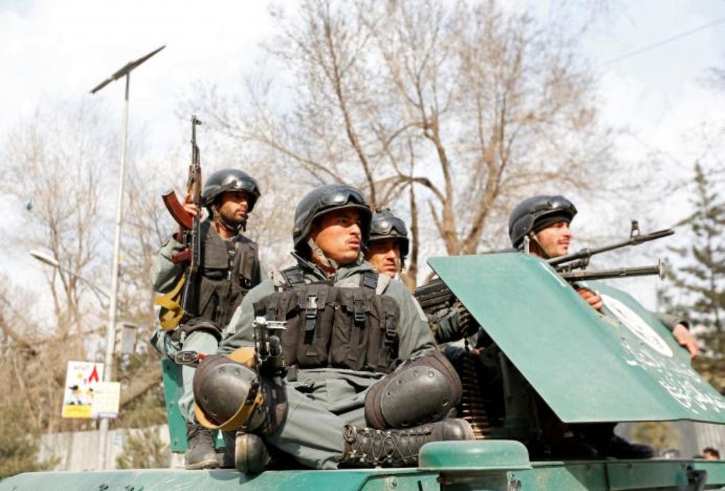 Afghan policeman arrive at the site of a blast and gunfire in Kabul, Afghanistan March 8, 2017. REUTERS/Mohammad Ismail.