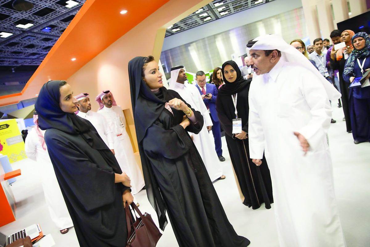 H H Sheikha Moza bint Nasser and H E Sheikha Hind bint Hamad Al Thani at the QITCOM exhibition, yesterday.