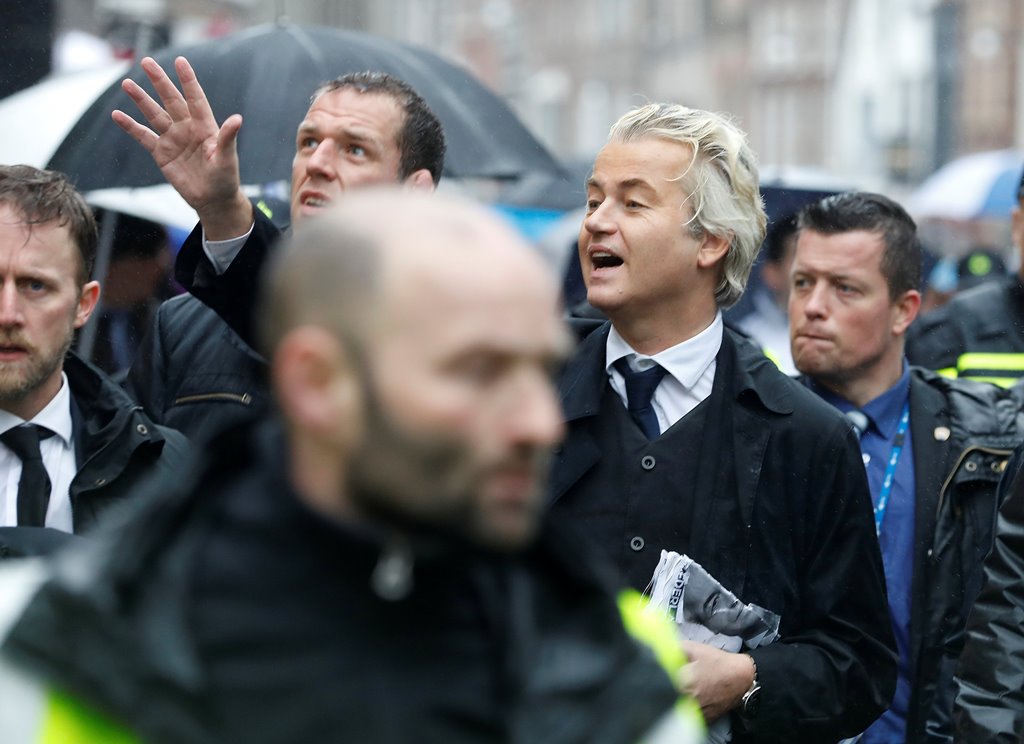 Dutch far-right politician Geert Wilders of the PVV Party is surrounded by security during his campaign for the Dutch election, in Breda, Netherlands, March 8, 2017. REUTERS/Yves Herman
