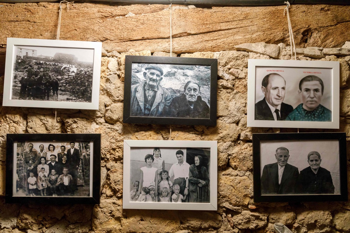 Photographs of former inhabitants of Sarnago hanging on a wall of the 'Friends of Sarnago' association museum, in the uninhabited village of Sarnago, in the northern Spanish province of Soria, photographed on February 28, 2017. Rural emigration in many ar
